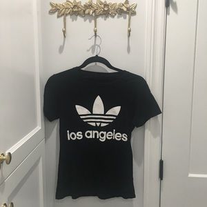 Two Adidas shirts small and medium